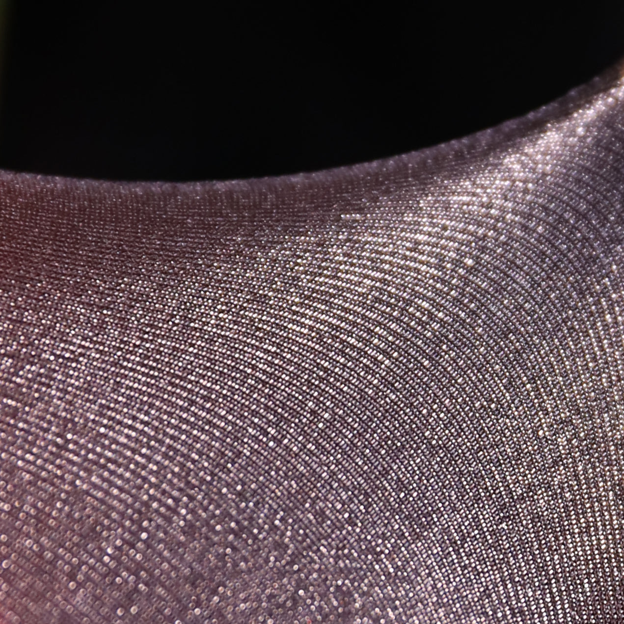 The delicate feel is derived from the texture of the yarn itself.